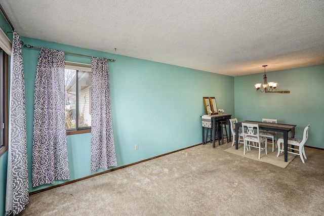 carpeted dining space with an inviting chandelier and a textured ceiling