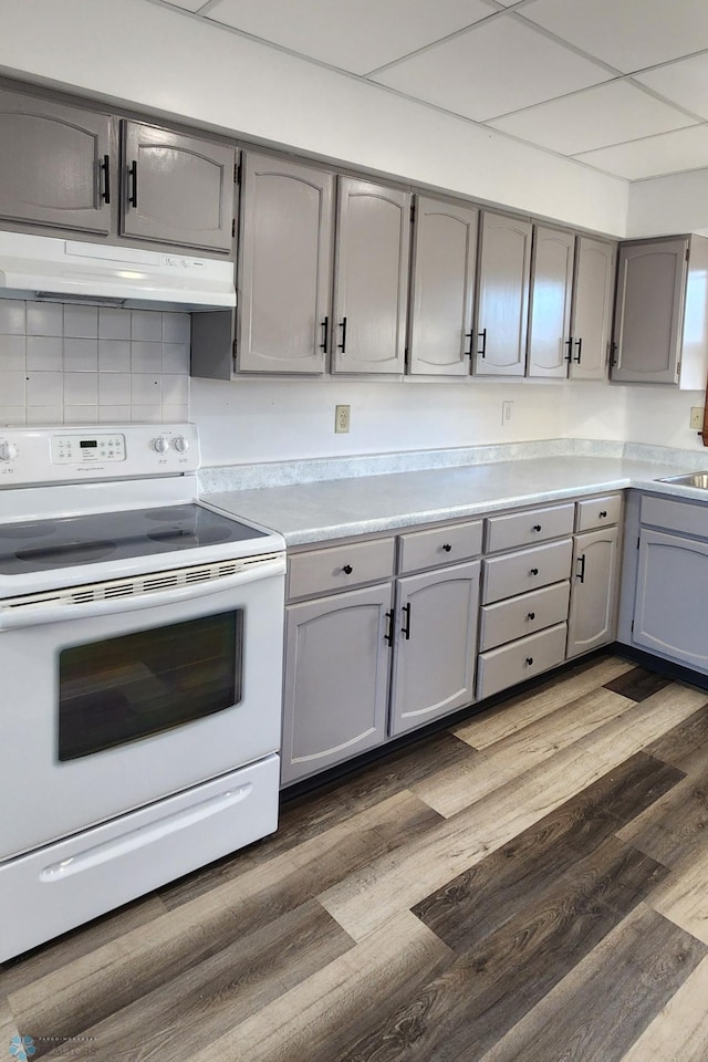 kitchen featuring gray cabinets, dark hardwood / wood-style floors, and white electric range