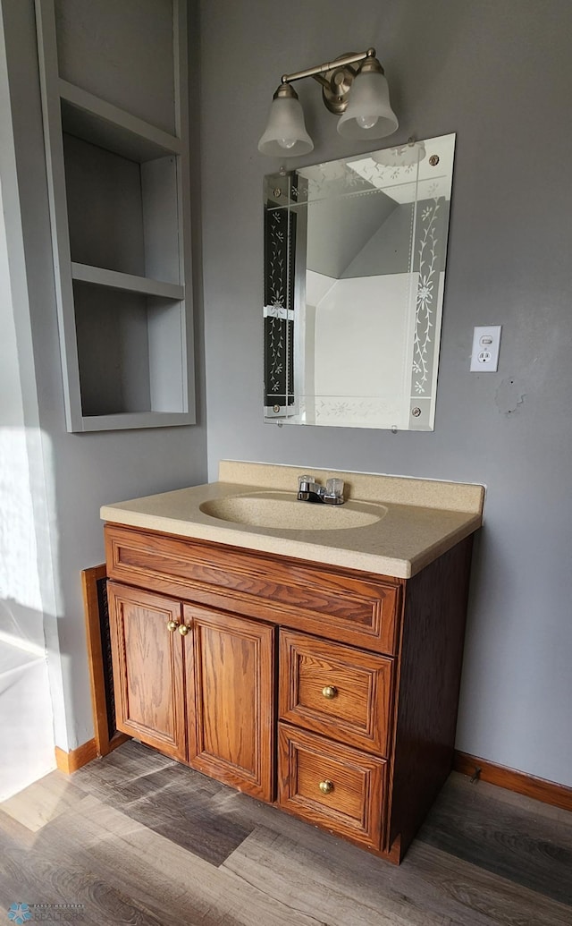 bathroom with vanity and hardwood / wood-style floors