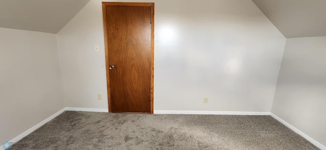 bonus room with carpet flooring and lofted ceiling