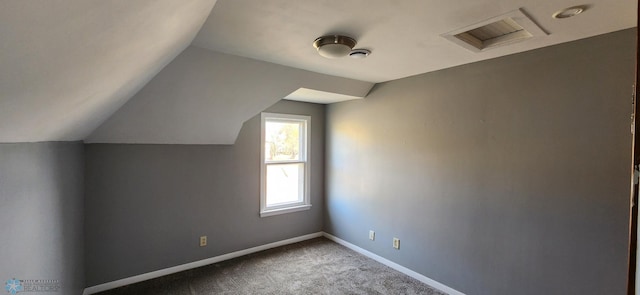 additional living space with lofted ceiling and carpet flooring