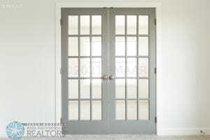 8447 61st St S, Horace, ND 58047 - doorway to outside with french doors