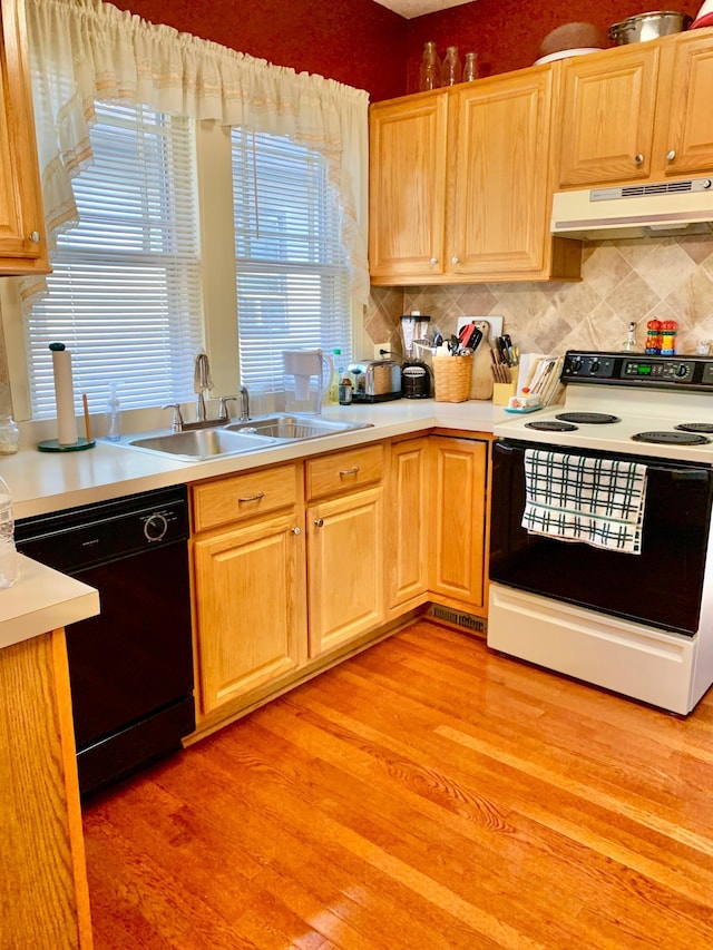 kitchen featuring light hardwood / wood-style flooring, white electric range, dishwasher, and sink