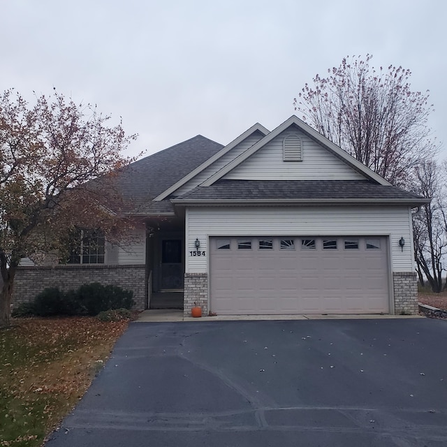 ranch-style home featuring a garage