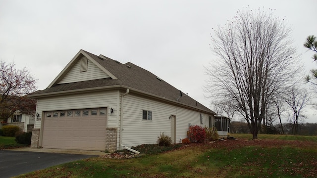 view of side of property featuring a garage