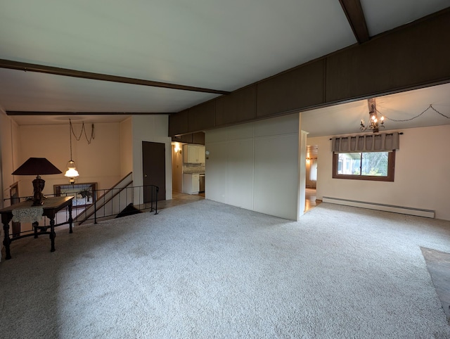 unfurnished living room with an inviting chandelier, beam ceiling, baseboard heating, and carpet