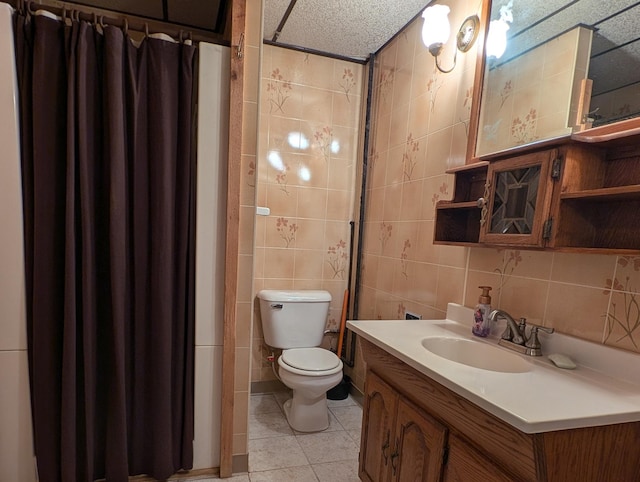 bathroom featuring vanity, toilet, tile walls, and tile patterned flooring