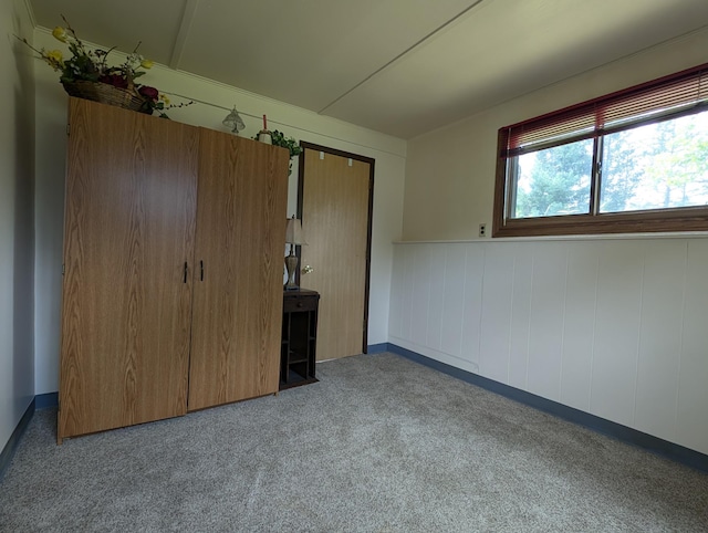 unfurnished bedroom featuring light carpet