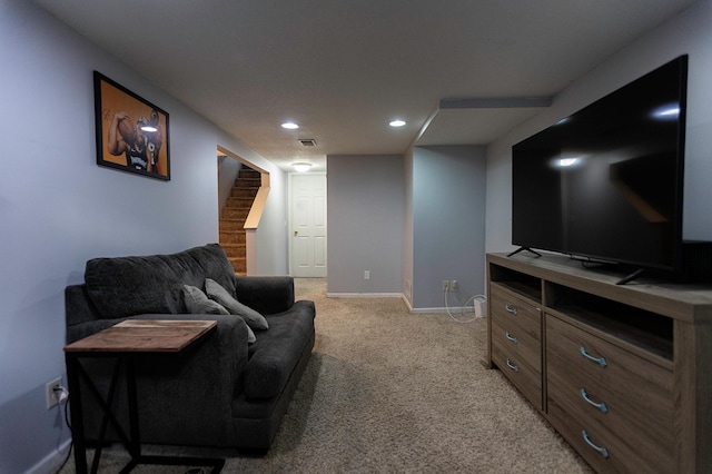 living area featuring recessed lighting, light colored carpet, visible vents, baseboards, and stairway