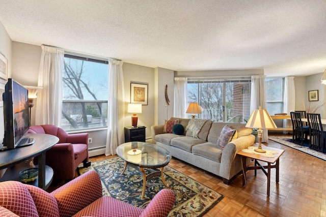 living room featuring a textured ceiling, parquet flooring, and a baseboard radiator