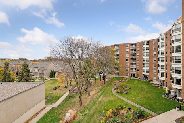 view of property's community with a yard