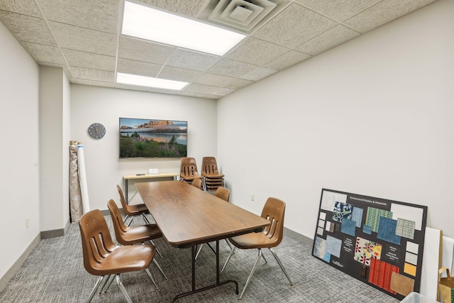 office area with a drop ceiling and carpet floors