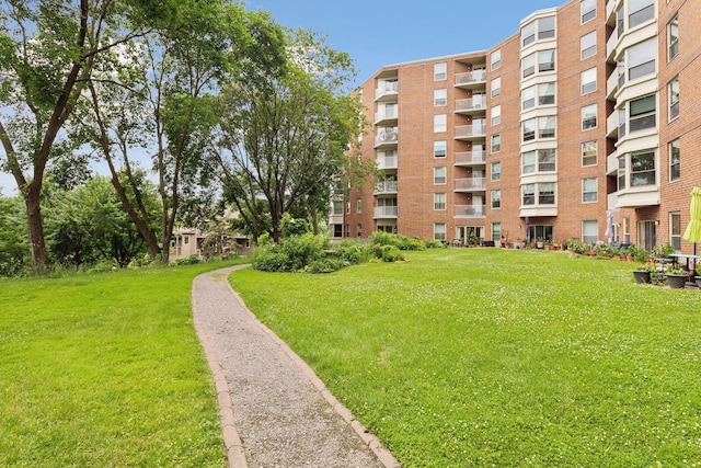 view of home's community featuring a yard