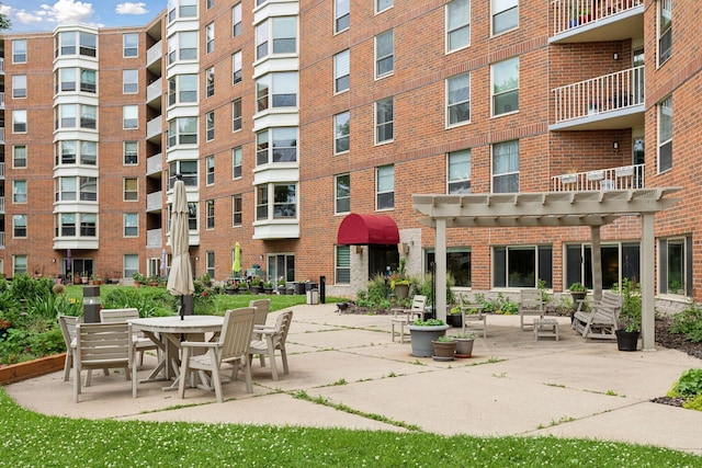 view of property's community with a patio area