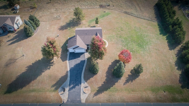 birds eye view of property with a rural view