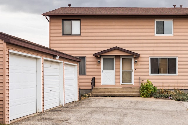 view of front of property with a garage