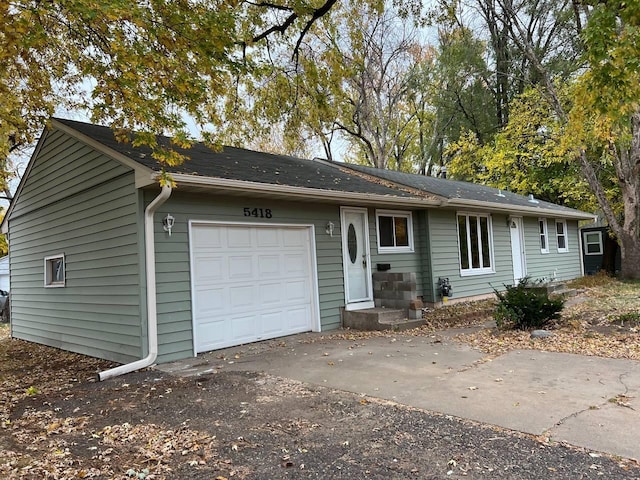 ranch-style house featuring a garage