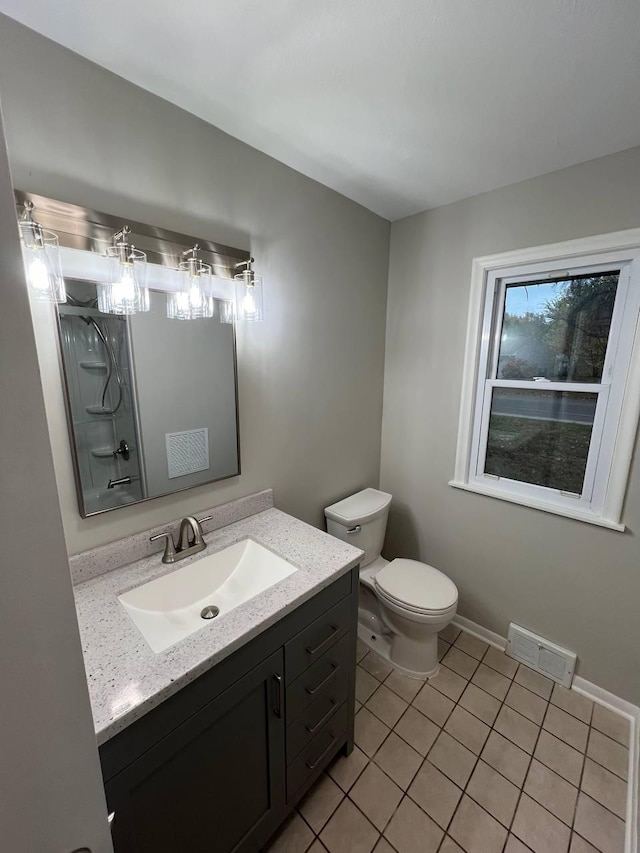 full bathroom featuring visible vents, toilet, tile patterned floors, walk in shower, and vanity