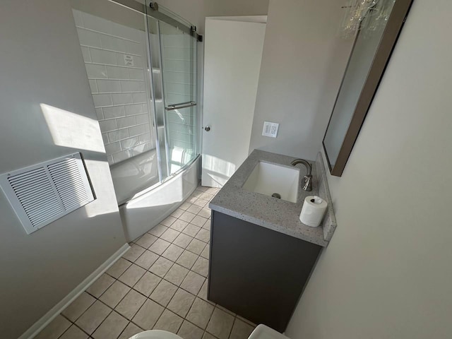 full bath featuring enclosed tub / shower combo, visible vents, vanity, and tile patterned floors