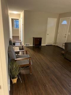 interior space with dark wood finished floors and visible vents