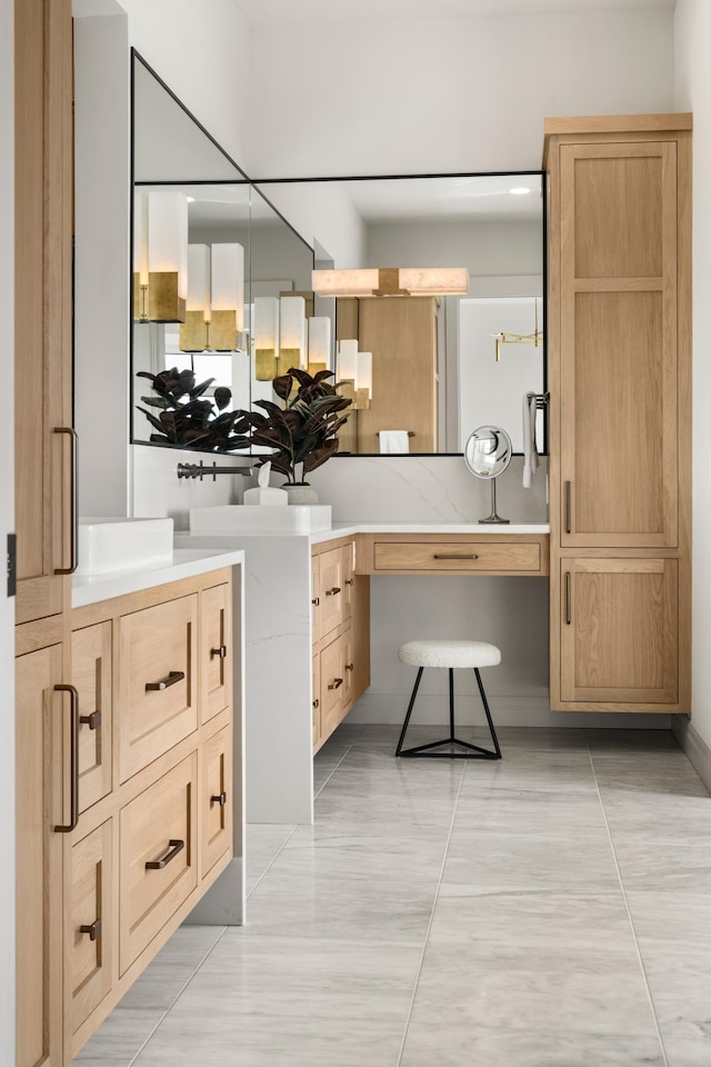 bathroom with tile patterned floors and vanity