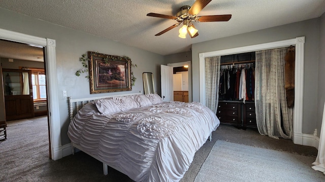carpeted bedroom with a closet, a textured ceiling, and ceiling fan