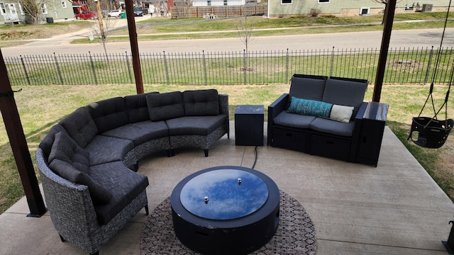 view of patio with outdoor lounge area and fence