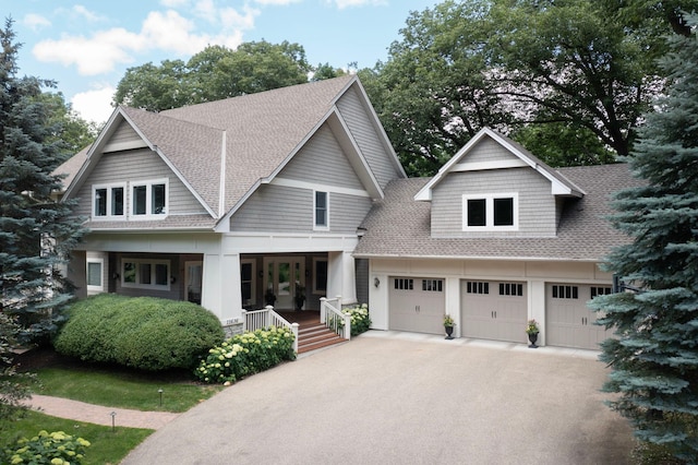 craftsman inspired home featuring a porch and a garage