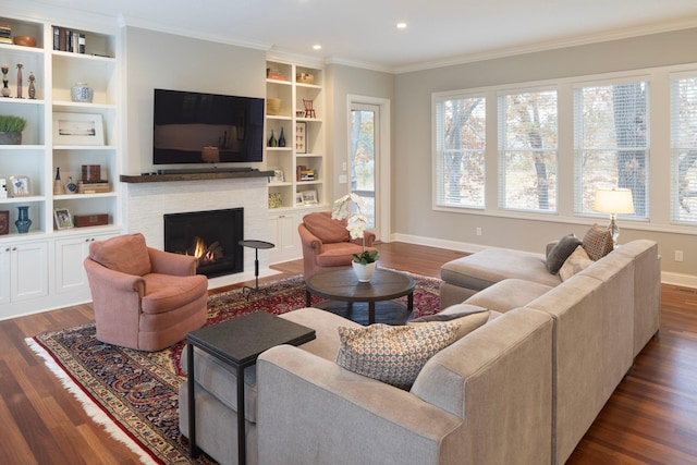 living room featuring dark hardwood / wood-style flooring and a healthy amount of sunlight