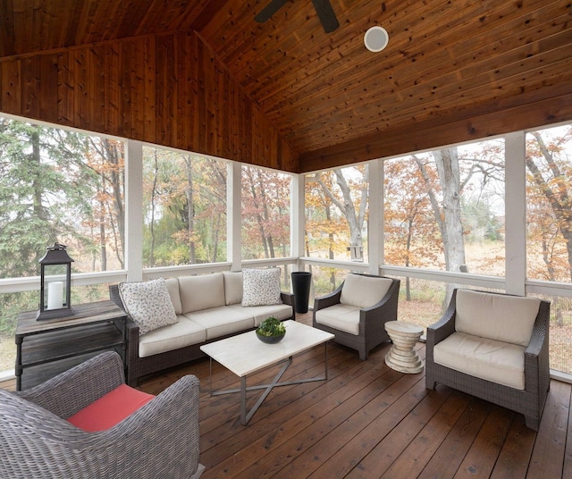 sunroom with lofted ceiling, wooden ceiling, and ceiling fan