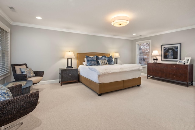 bedroom with crown molding and light colored carpet