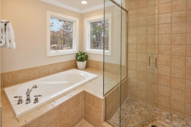 bathroom featuring crown molding and separate shower and tub