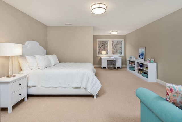 bedroom with light carpet