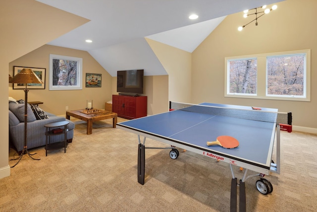 rec room with lofted ceiling and light colored carpet