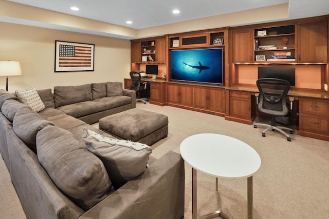 carpeted living room with built in desk