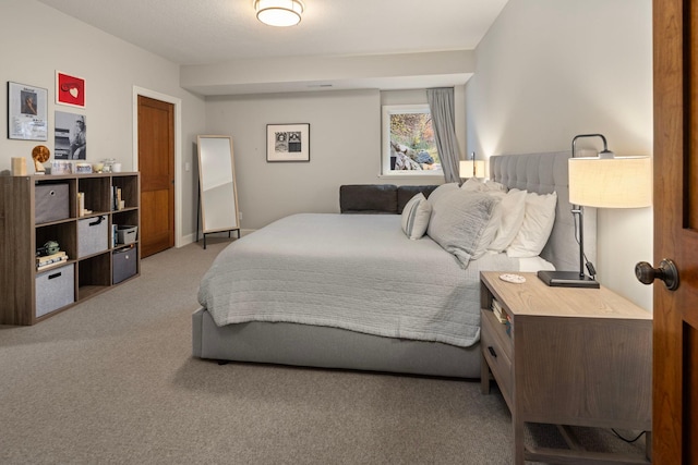 bedroom featuring light colored carpet