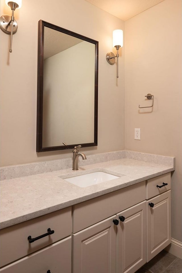 bathroom with vanity and tile patterned flooring