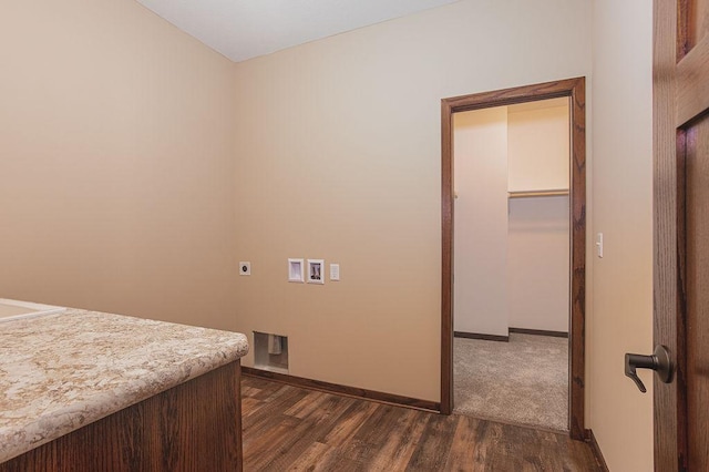 washroom featuring electric dryer hookup, hookup for a washing machine, and dark hardwood / wood-style floors