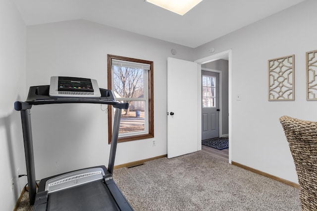 workout room with carpet, baseboards, and vaulted ceiling