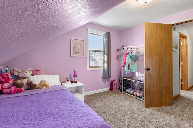 bedroom featuring carpet flooring, vaulted ceiling, a textured ceiling, and baseboards