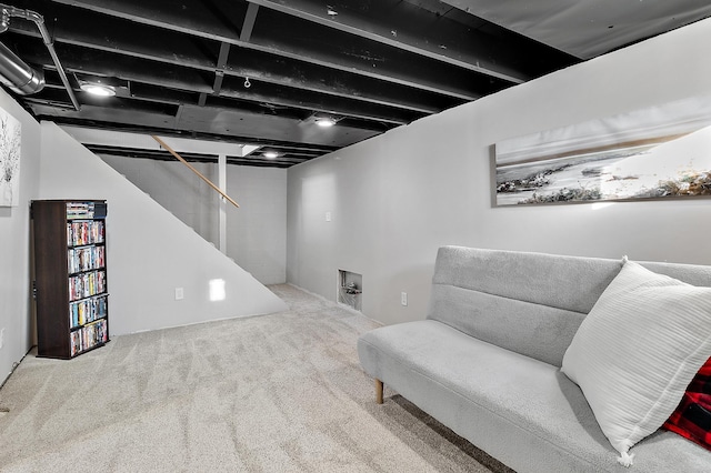 living area with carpet flooring and stairway