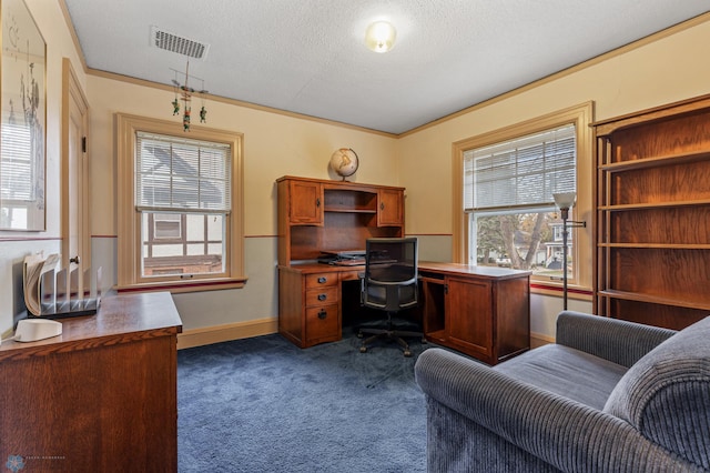 office area with dark carpet, a textured ceiling, and ornamental molding