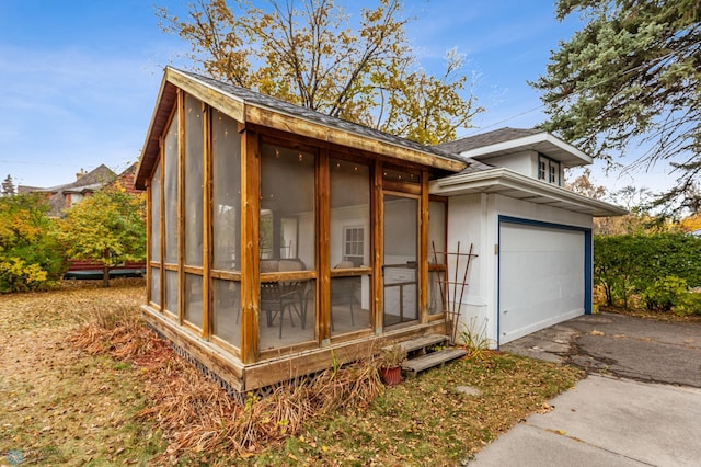 view of side of property with a garage