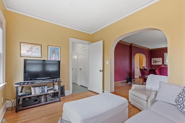 living room featuring hardwood / wood-style flooring and ornamental molding