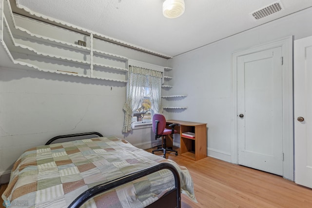 bedroom featuring hardwood / wood-style flooring