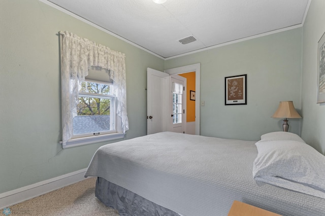 bedroom featuring carpet and crown molding