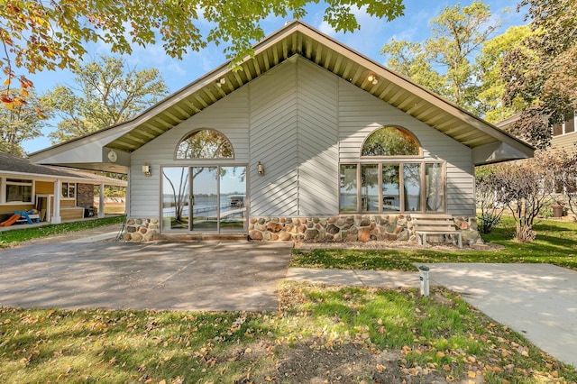 exterior space with stone siding