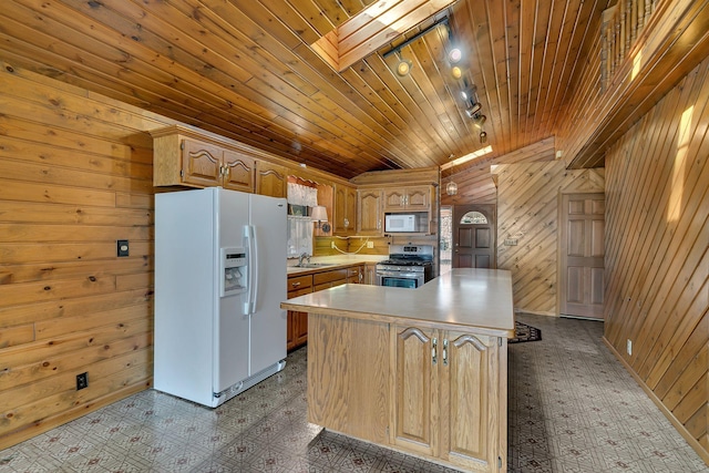 kitchen featuring tile patterned floors, white appliances, wooden walls, a skylight, and wood ceiling