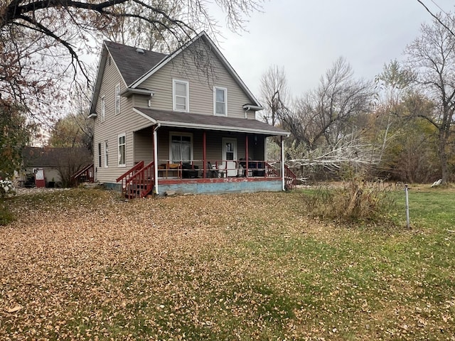 view of front facade with a porch and a front lawn