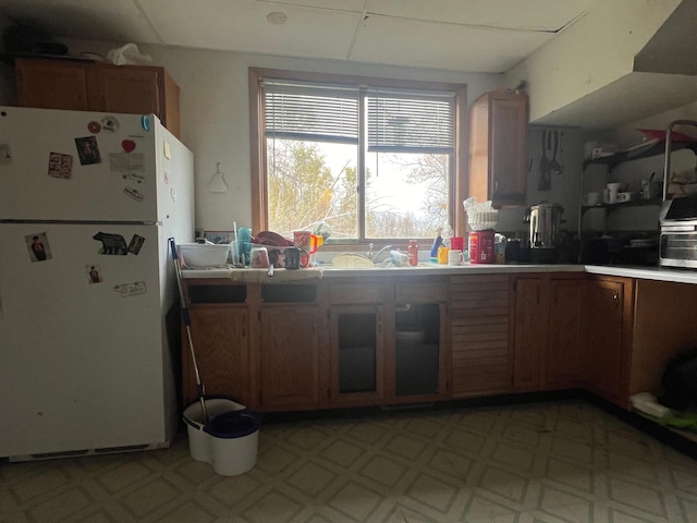 kitchen featuring white fridge